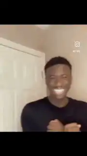 Man smiles then looks back at door