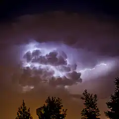 Lightning strikes in a storm cloud