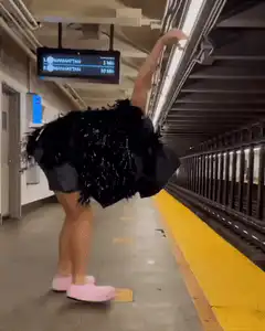 Woman in ostrich costume on subway platform