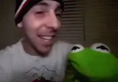 Kermit the Frog kisses a guy