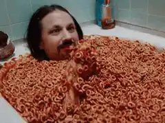 Man eating cereal in bathtub