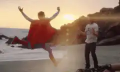 Superman cape kick on beach