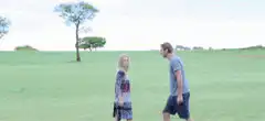 Man and woman dancing in a field