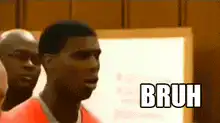 Man in orange shirt says BRUH