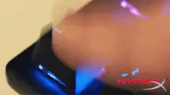 Finger pressing ESC key with RGB lighting