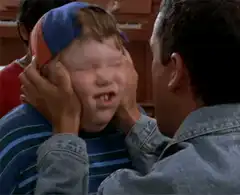 Boy getting his face squished
