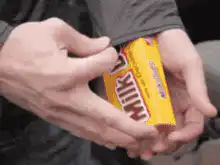 Person pulling snacks from waistband