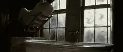 Man in chair falling backward