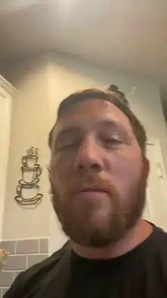 bearded man with closed eyes