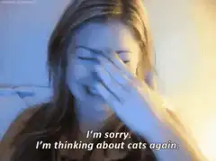 Girl facepalms thinking about cats