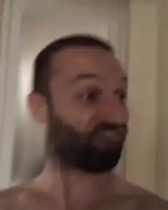 shirtless man making funny faces