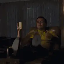 Walter White pointing with coffee mug