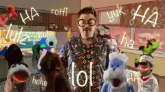 Man surrounded by laughing puppets