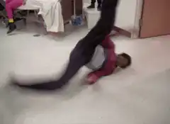 person doing a backflip in a hospital room
