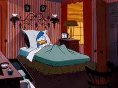 Donald Duck wakes up startled in bed