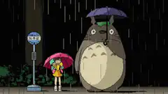 Totoro and Mei waiting at the bus stop in the rain