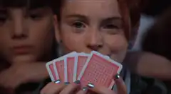Girl holding playing cards