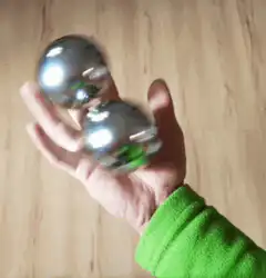 Hand juggling two metal balls