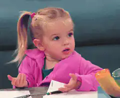 little girl shrugs and gasps