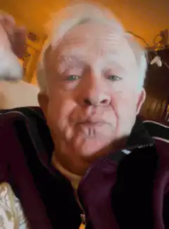 Old man resting his head on his hand
