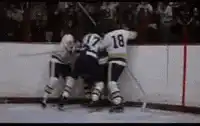 Hockey player thrown over glass