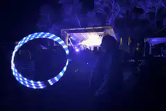 LED hoop dancer at night concert