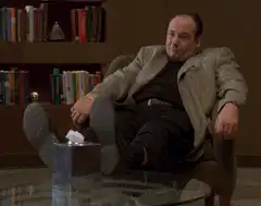 Tony Soprano relaxing with feet on table