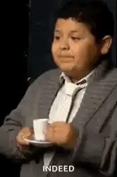 Richie drinking tea and nodding