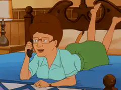 Betty on the phone in bed