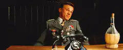 Hitler shrugs at desk