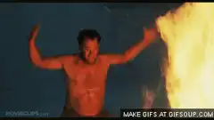 Man touching fire with arms out