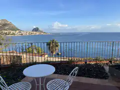 Balcony view of sea and mountains