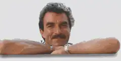 Tom Selleck leaning on a bar