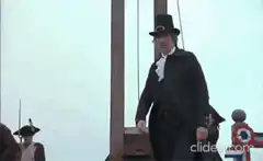 Man in top hat near guillotine