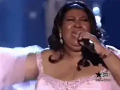 Aretha Franklin performing on stage