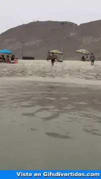 Man slips and falls on wet sand
