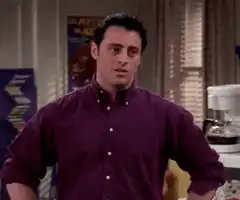 Joey Tribbiani smugly crosses his arms