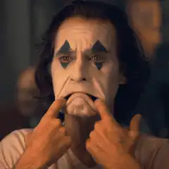 Joker stretches his face into a smile