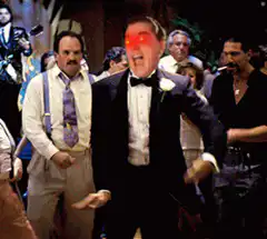 Man in tuxedo with glowing red eyes dancing
