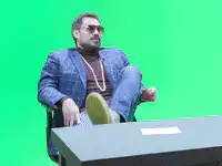 Man puts feet on desk