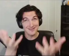 Man with headphones making excited hand gestures