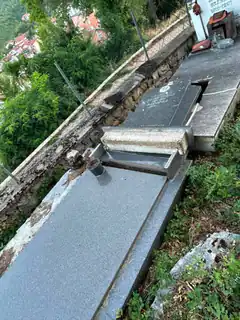 Grave with broken lid and cup