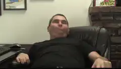 Man leaning back with puffed cheeks