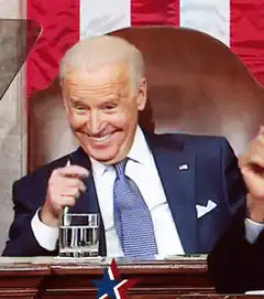 Joe Biden smiling and pointing