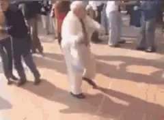 Old man dancing in white suit