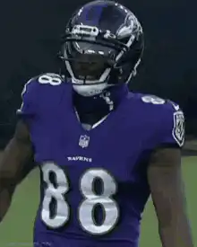 Ravens player crosses arms
