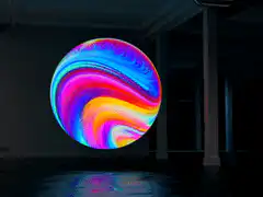 Colorful psychedelic sphere in dark room