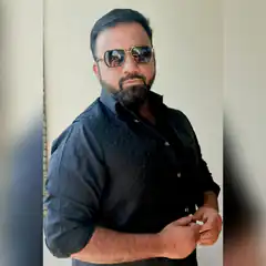 Man in black vest and sunglasses