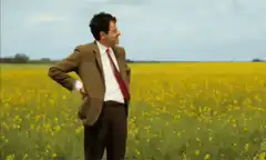 Andy Dwyer in a field of yellow flowers