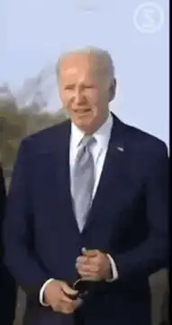 Joe Biden puts on sunglasses